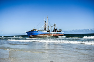 Abandoned and Moored Fishing Trawler Nautical Vessel Shipwrecked on the Atlantic Ocean along the Coast of Florida