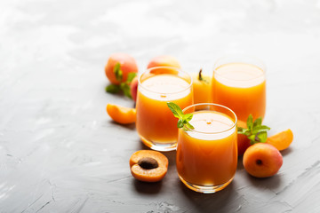 Fresh apricot juice on the marble table