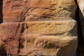 Close up of eroded sea wall on the coast at Scarborough, Yorkshire, UK