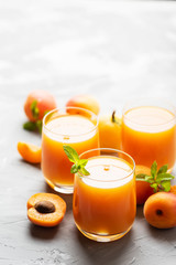 Fresh apricot juice on the marble table
