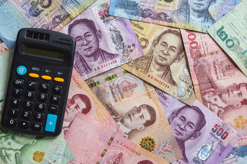 Thai banknotes money background with calculator