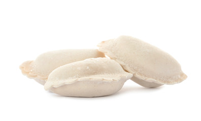 Raw dumplings with tasty filling on white background