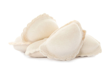 Heap of raw dumplings on white background