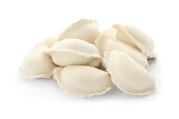 Heap of raw dumplings on white background