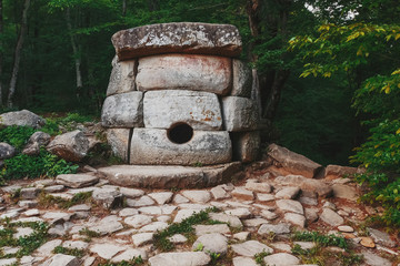 Ancient round compound dolmen in the valley of the river Jean, Monument of archeology megalithic...