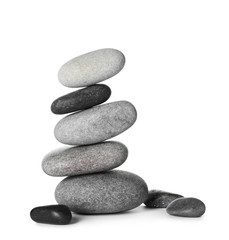 Stack of spa stones on white background