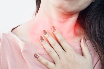 Asian woman suffering from acid reflux or heartburn 