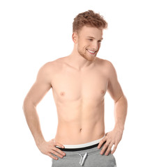 Fototapeta premium Portrait of young man with slim body on white background