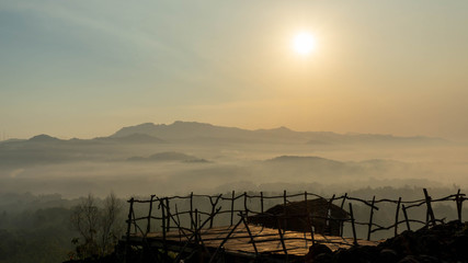 Obraz premium sunrise views in the summer that emerge from the hills in a village
