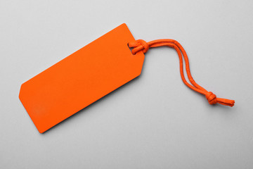 Cardboard tag with space for text on light background, top view