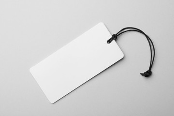 Cardboard tag with space for text on light background, top view