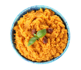 Bowl with mashed sweet potatoes on white background, top view
