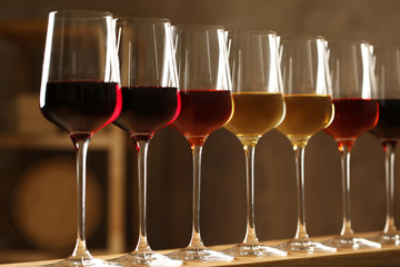 Glasses of different wines in cellar. Expensive collection