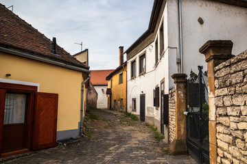 Fototapeta na wymiar Street of Szentendre at the morning. Szentendre is a small idyllic town by the Danube river near the Budapest - capital of Hungary. Town of arts and popular destination for tourists in Budapest.