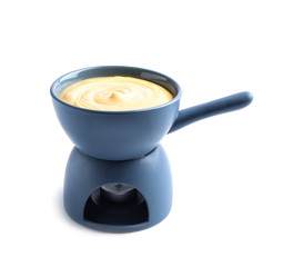 Pot with delicious cheese fondue on white background