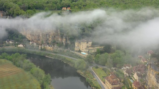 Aerial view from above. La Roque-Gageac and Castle Mallartrie in the Dordogne department, Nouvelle-Aquitaine, southwestern France.