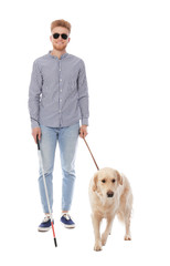 Blind person with long cane and guide dog on white background