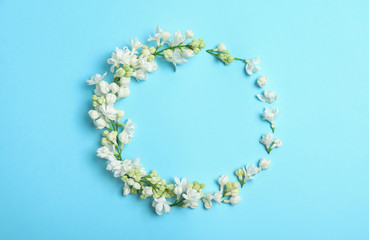Flat lay composition with blossoming lilac flowers on color background. Space for text