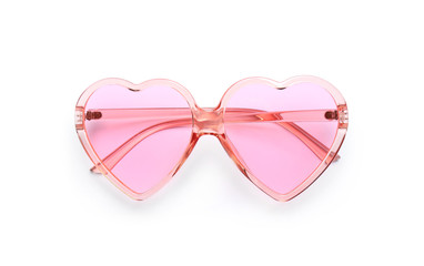 Stylish heart shaped glasses on white background