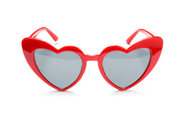 Stylish heart shaped glasses on white background