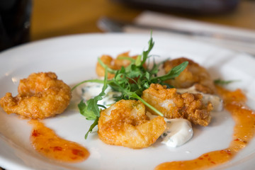 Fried breaded shrimps on plate