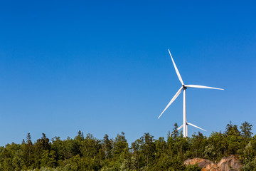 Windmills and blue sky in the summer time