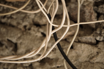 Abstract image of electric wires on abandoned concrete wall