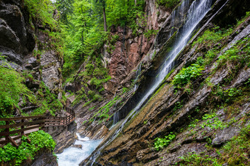 A lot of Waterfalls in the Wimbacklamm in Bavaria Berchtesgaden with stones and green plants and...