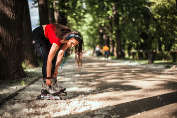 Smiling girl enjoying outdoors while rollerblading