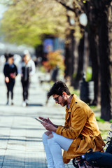 Fototapeta premium Urban businessman looking at his tablet