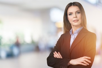 Portrait of a young businesswoman on background