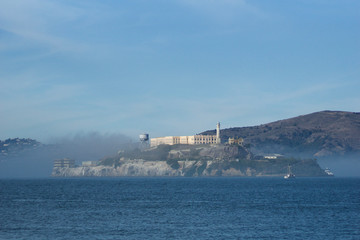 SAN FRANCISCO, CALIFORNIA, UNITED STATES - NOV 25th, 2018: Alcatraz prison in fog panorama during a...