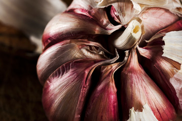 garlic on wood frame and dark background