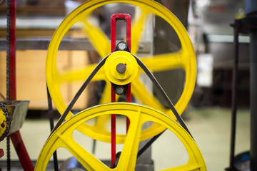 Red and yellow gears with strap