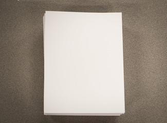 Stack of blank paper on desk