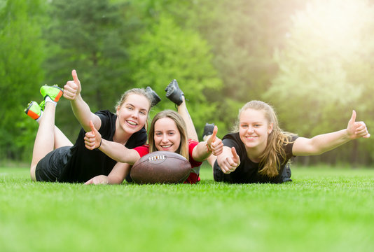 Pretty american football players celebrating their win on a sunny day - Powered by Adobe