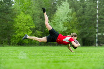 Girl playing rugby together outside in summer