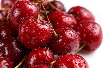Nature background. Big beautiful water drops on ripe and juicy fresh picked cherry berries closeup. Macro view of abstract nature texture and background organic pattern. Copy space. Macro shot