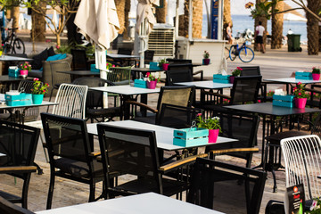 restaurant patio exterior environment of tables and chairs furniture in blossom park outdoor summer place