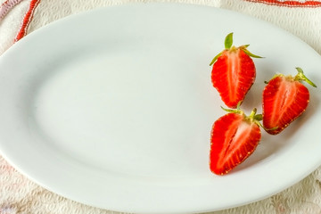 Three juicy fresh strawberries 