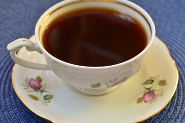 Coffee in porcelain tea set in closeup