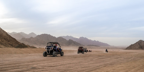 trip of tourists to the desert on the offroad buggy in Egypt