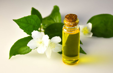 bottle of essential oil with flowers