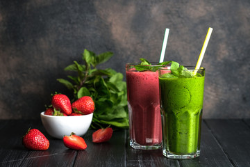 Organic berry and vegetable smoothie with oatmeal on a dark background. Healthy food. Lactose free diet.
