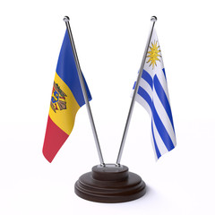 Moldova and Uruguay, two table flags isolated on white background. 3d image