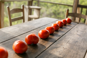 Red Tomatoes On A Wooden Table