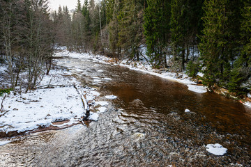 frozen river in winter countryside