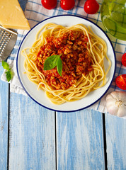 spaghetti bolognese on wooden surface