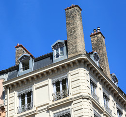 Fototapeta na wymiar French style chimneys above the roof of the house