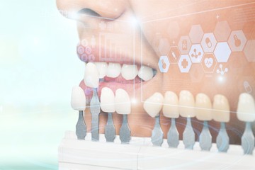 Happy woman dentist at her office smiling